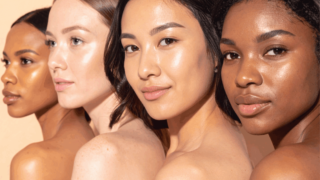 Four diverse women with radiant, glowing skin posing confidently, representing healthy and luminous skin over 40.
