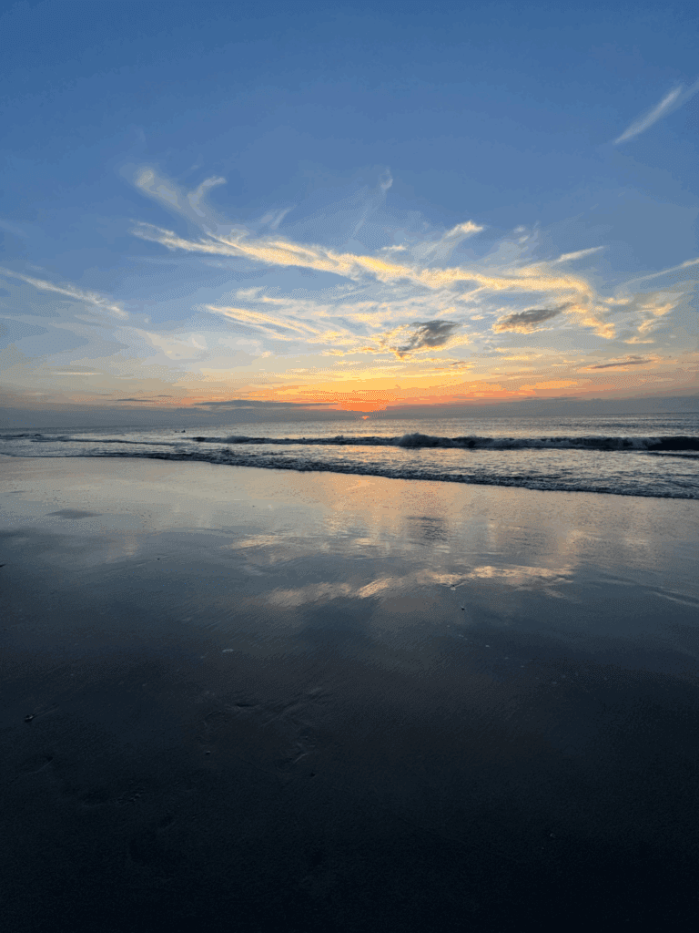 Sunrise over the ocean symbolizing new beginnings and overcoming fear.