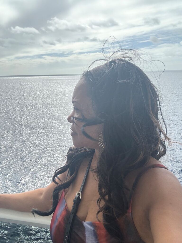 Woman over 50 looking out over the ocean and reflecting her next chapter in life